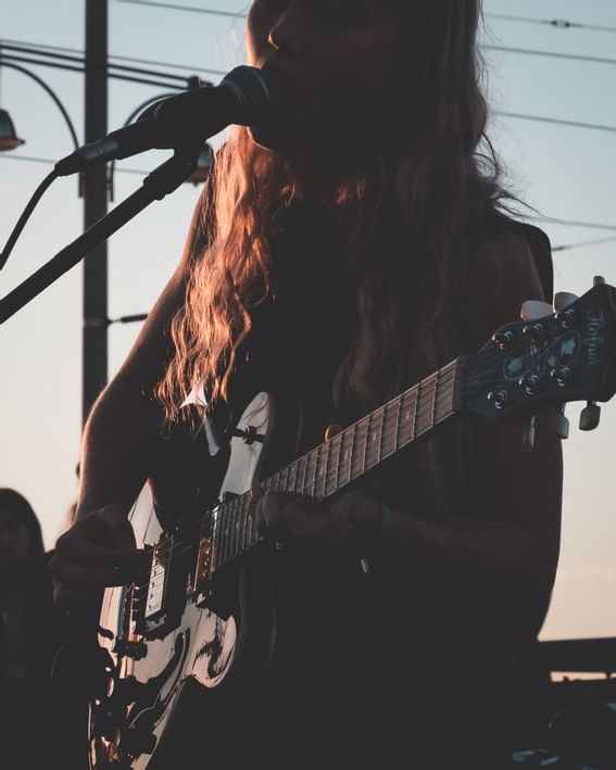 Man play the guitar and sing at The Rockaway Hotel