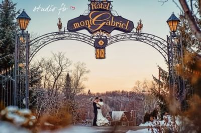 Wedded couple at entrance of Hotel Mont Gabriel Resort & Spa