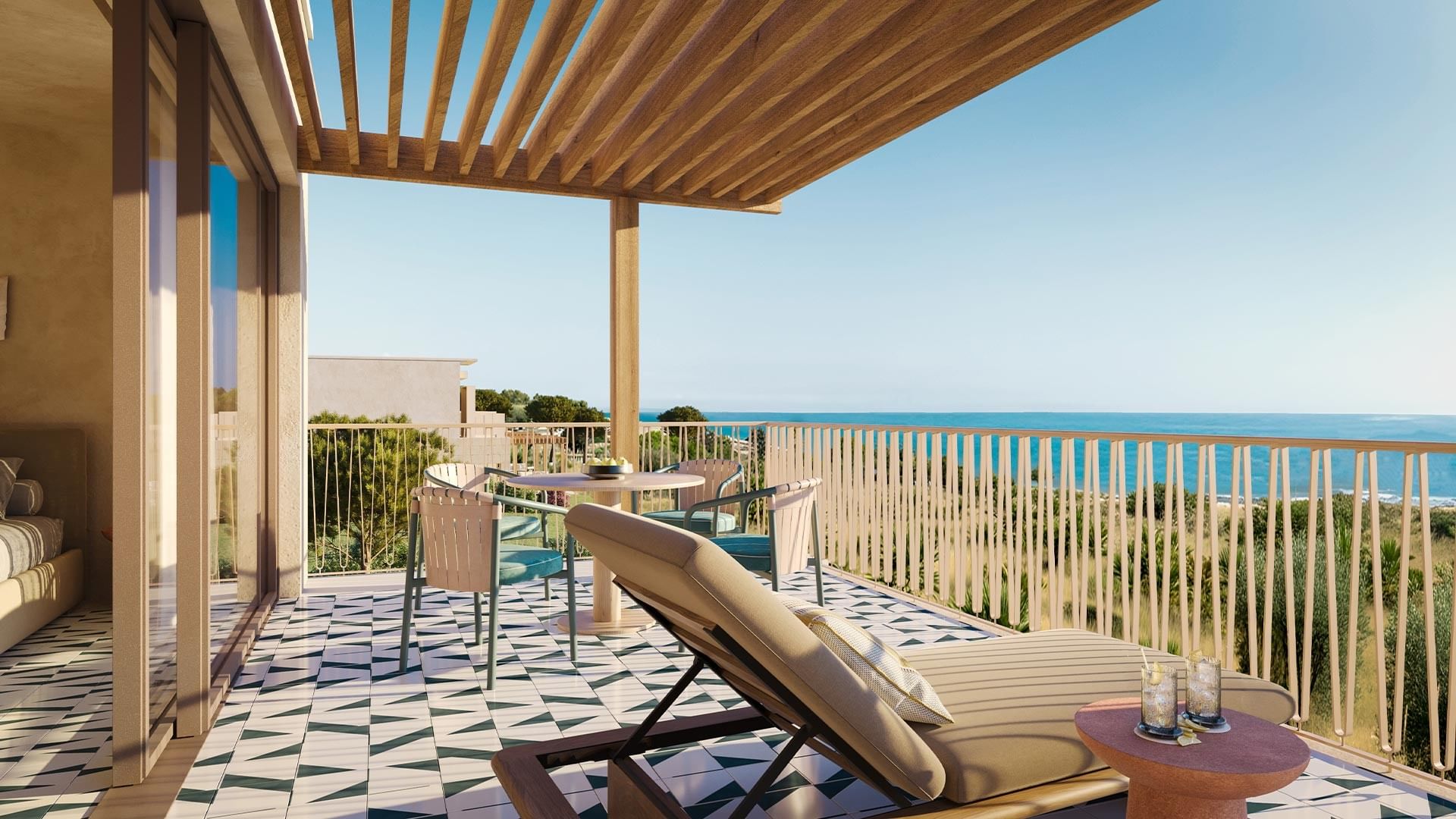 Balcony with lounge chair, table, and ocean view, featuring geometric tile floor and wooden pergola.
