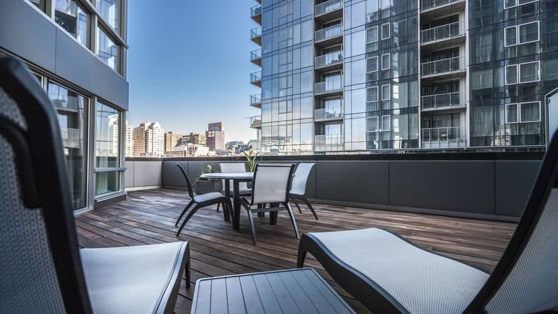 Balcony with seating area in Penthouse Suite Sainte-Catherine at Warwick Le Crystal
