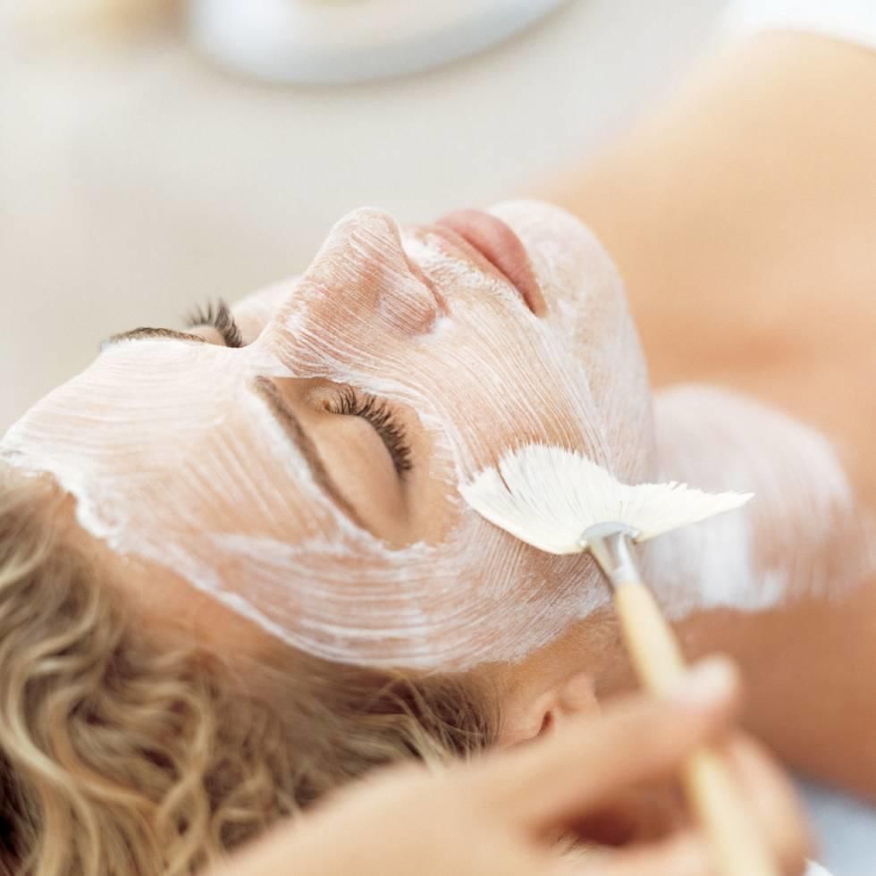 Applying a facial mask on woman's face at Falkensteiner Hotels