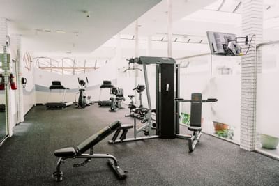 gym with updated equipment and TV at The Inn of Waterloo