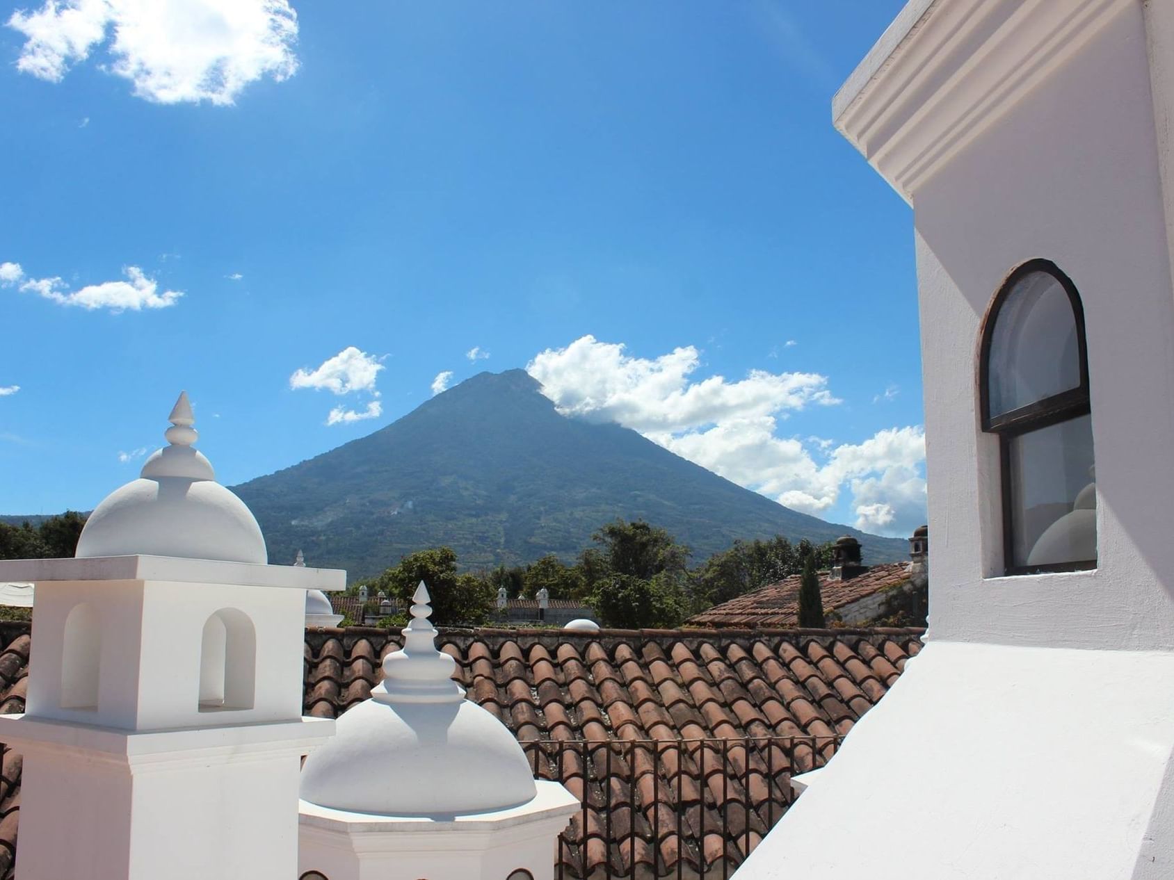 Rooftop overlooking the mountain & blue sky at Pensativo House Hotel