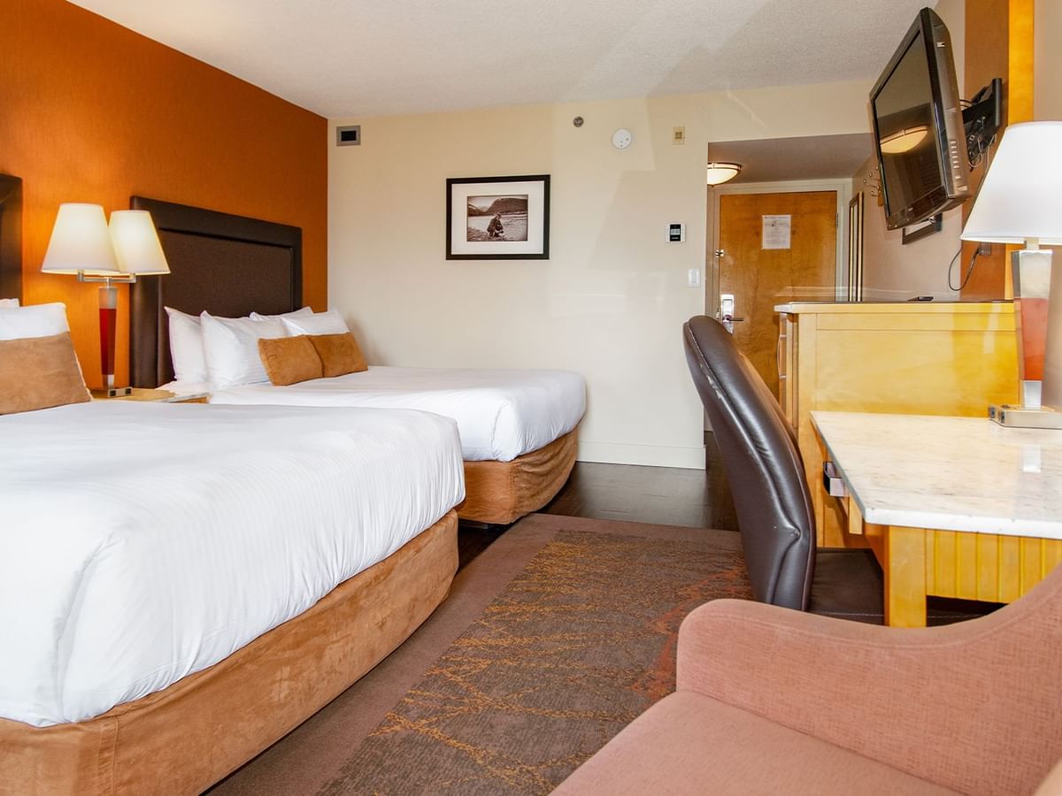 Hotel guest room with two queen beds and a balcony