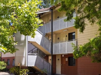 Exterior of UniLodge at Curtin University Guild House with stairs and balconies.