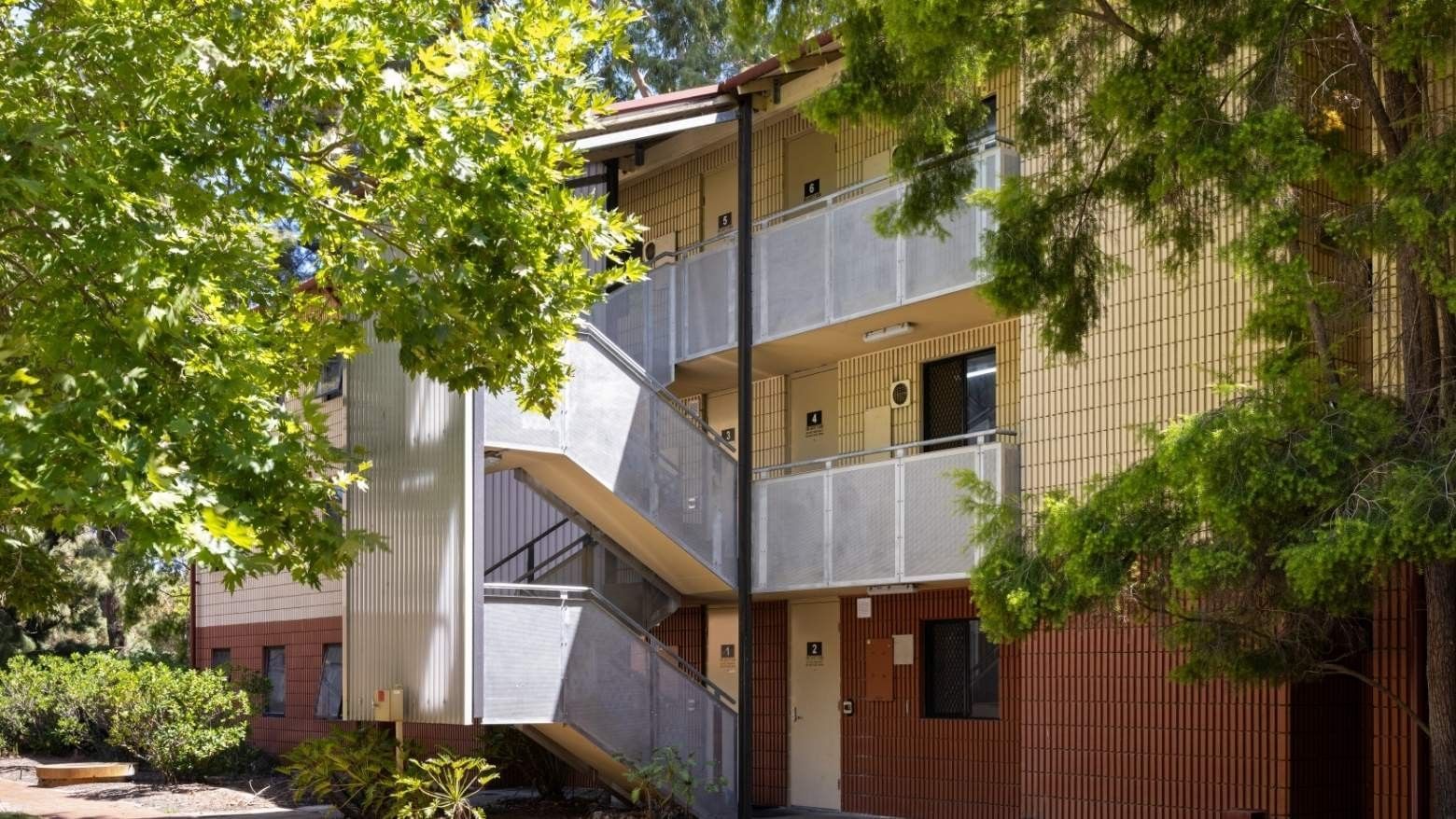 Exterior of UniLodge at Curtin University Guild House with stairs and balconies.