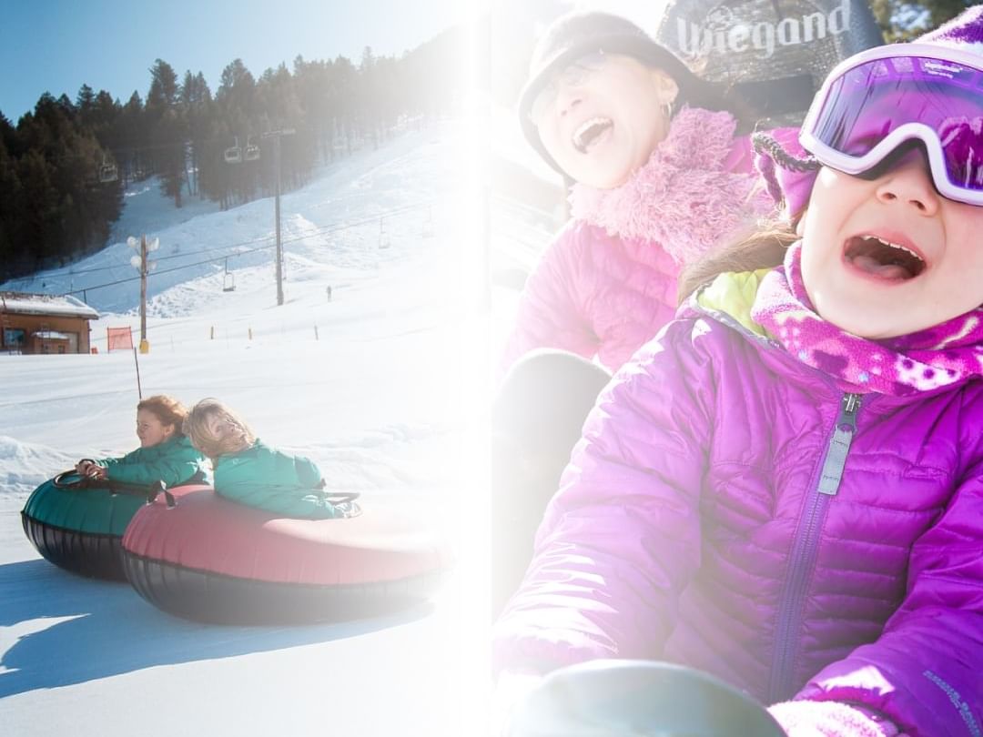 Children enjoying tubing on the snow near Hotel Jackson