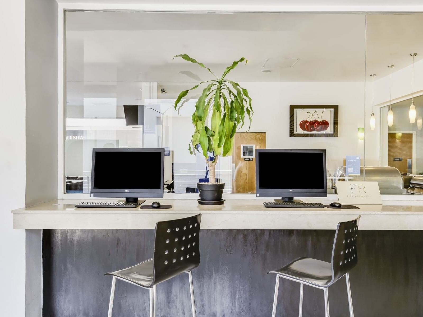 Close-up of a working area with computers at One Hotels