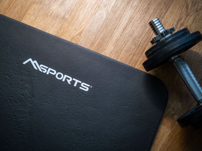 Dumbbell next to a black exercise mat in the Fitness Room at Starling Hotels in Lausanne Switzerland