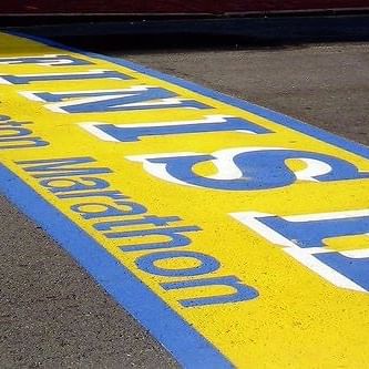 The finish line of the Boston Marathon painted on the pavement