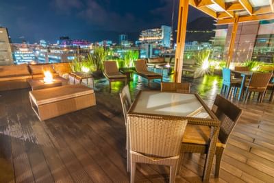 Night view of the outdoor chilling area at the rooftop with ligh