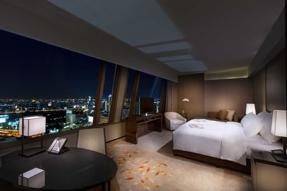 Prestige club Bedroom at Okura Prestige Bangkok at night time