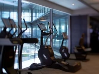 Close-up of treadmills in the gym at Hotel Éclat Beijing