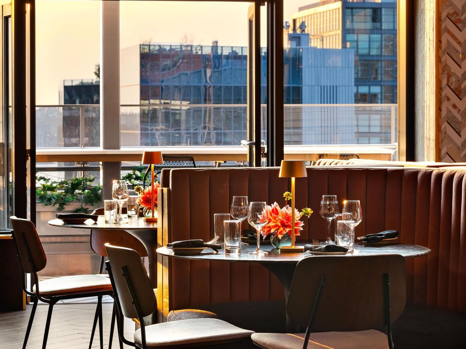 Table looking out at the city buildings at golden hour