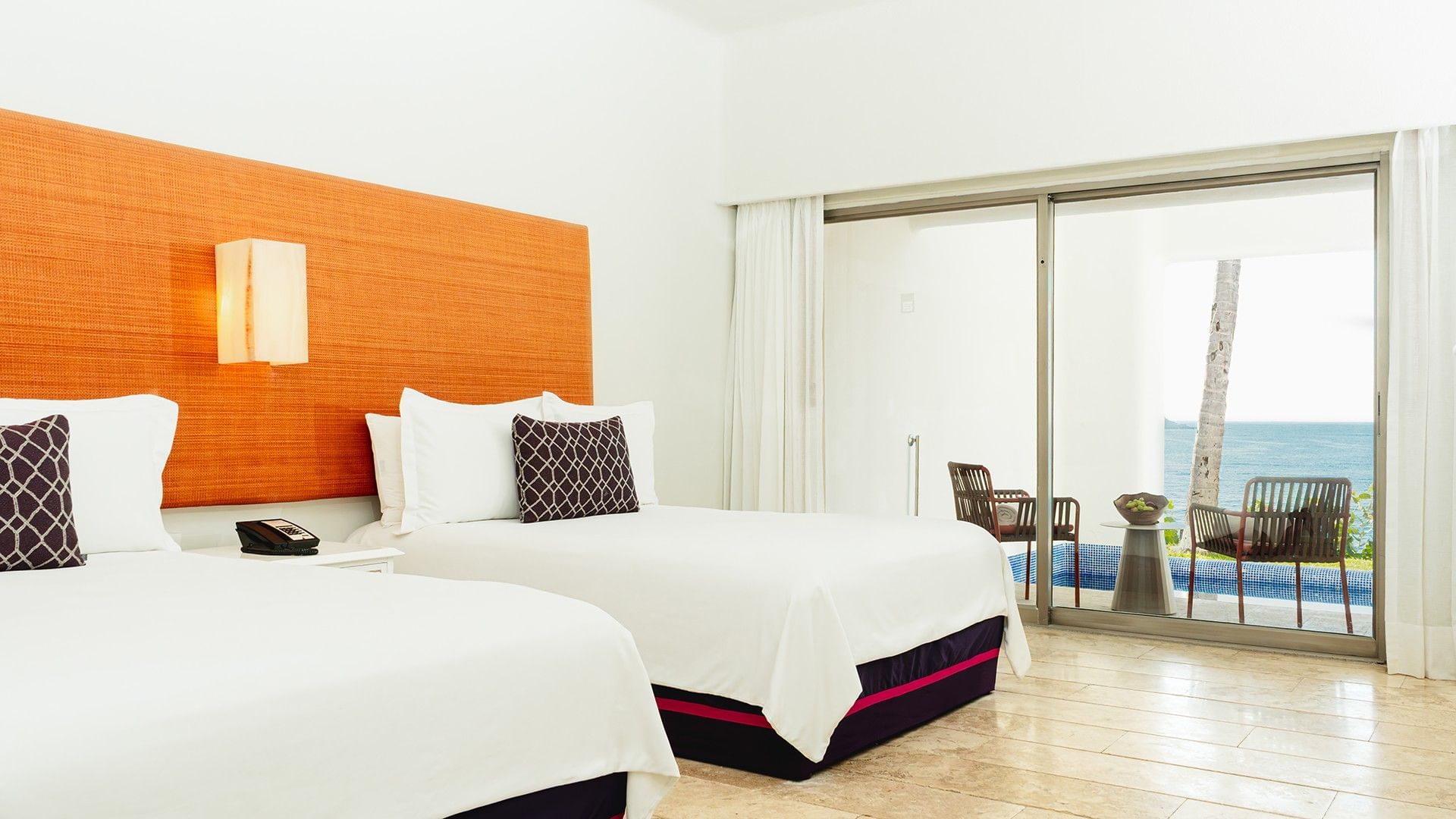 Nightstand by the beds in Two Double Camino Real Club with outdoor seating area at Camino Real Zaashila Huatulco