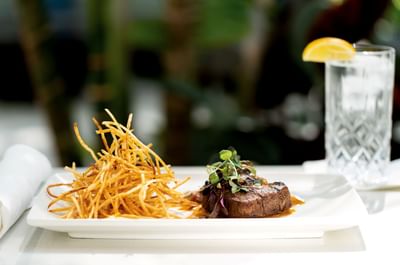 Beef dish served in restaurant at Innovation Hotel