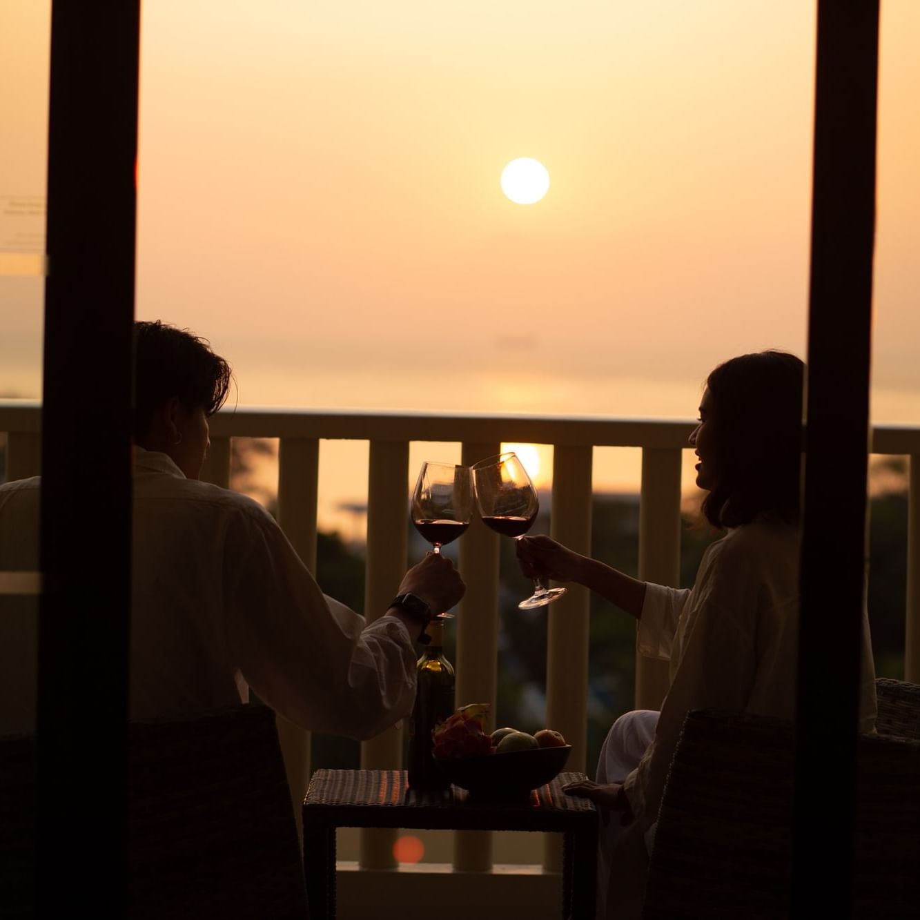 A romantic moment, watching sunset, at the balcony of Paradox Seaview Room