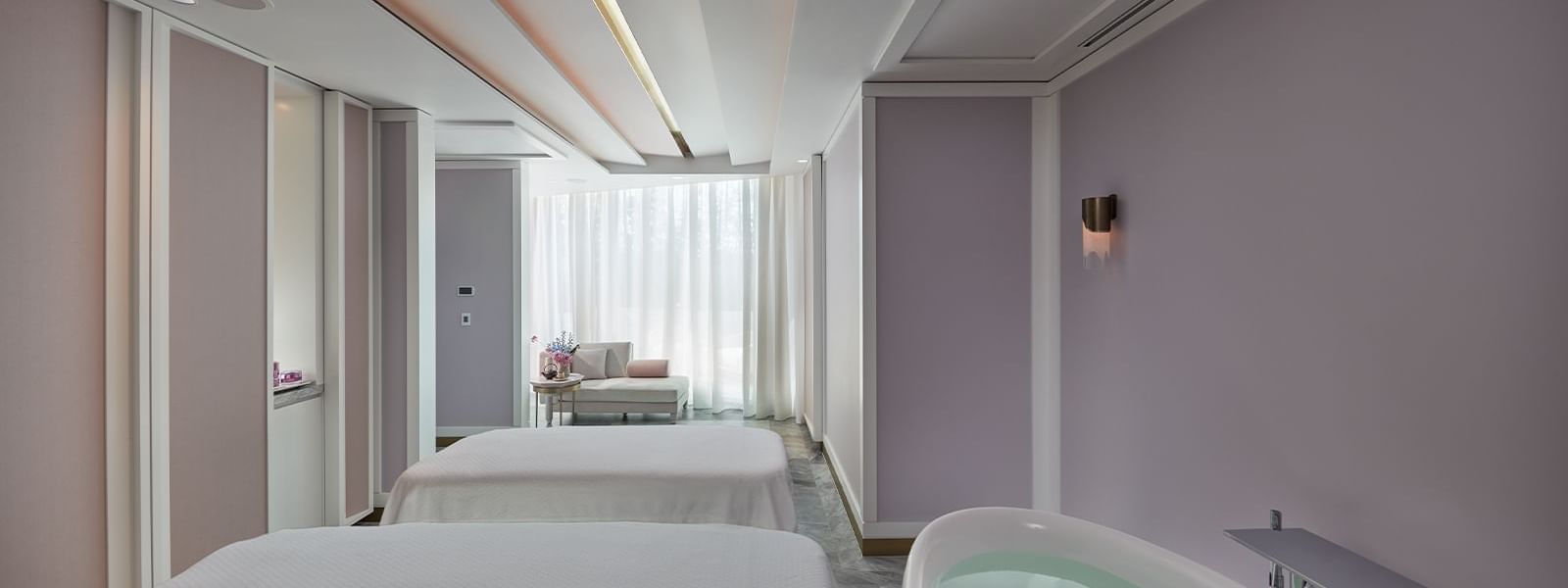 Two treatment beds & bathtub in Crown spa at Crown Hotels