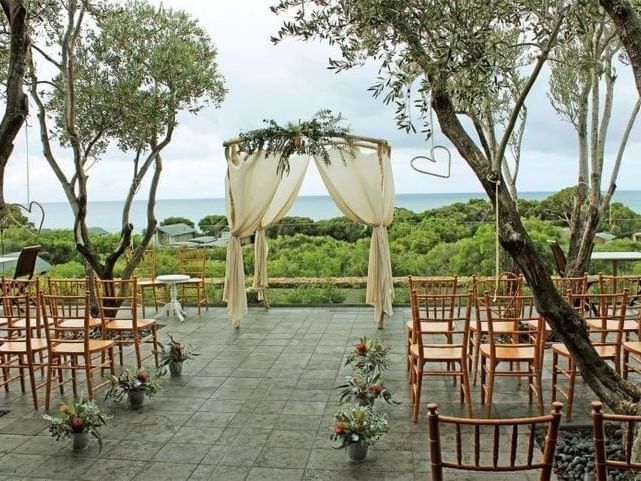 Outdoor wedding ceremony setup at Pullman Bunker Bay Resort