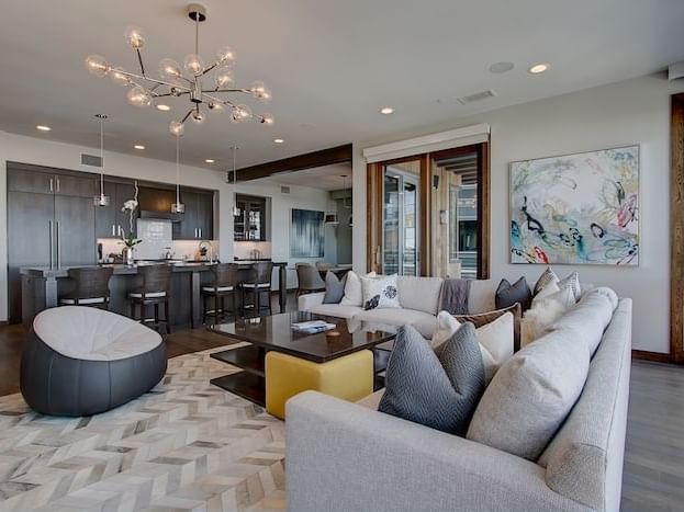 Living room area with modern interior in Three-bedroom Suites at Stein Eriksen Residences