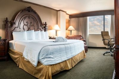 King bed in Deluxe King suite at MCM Elegante Beaumont