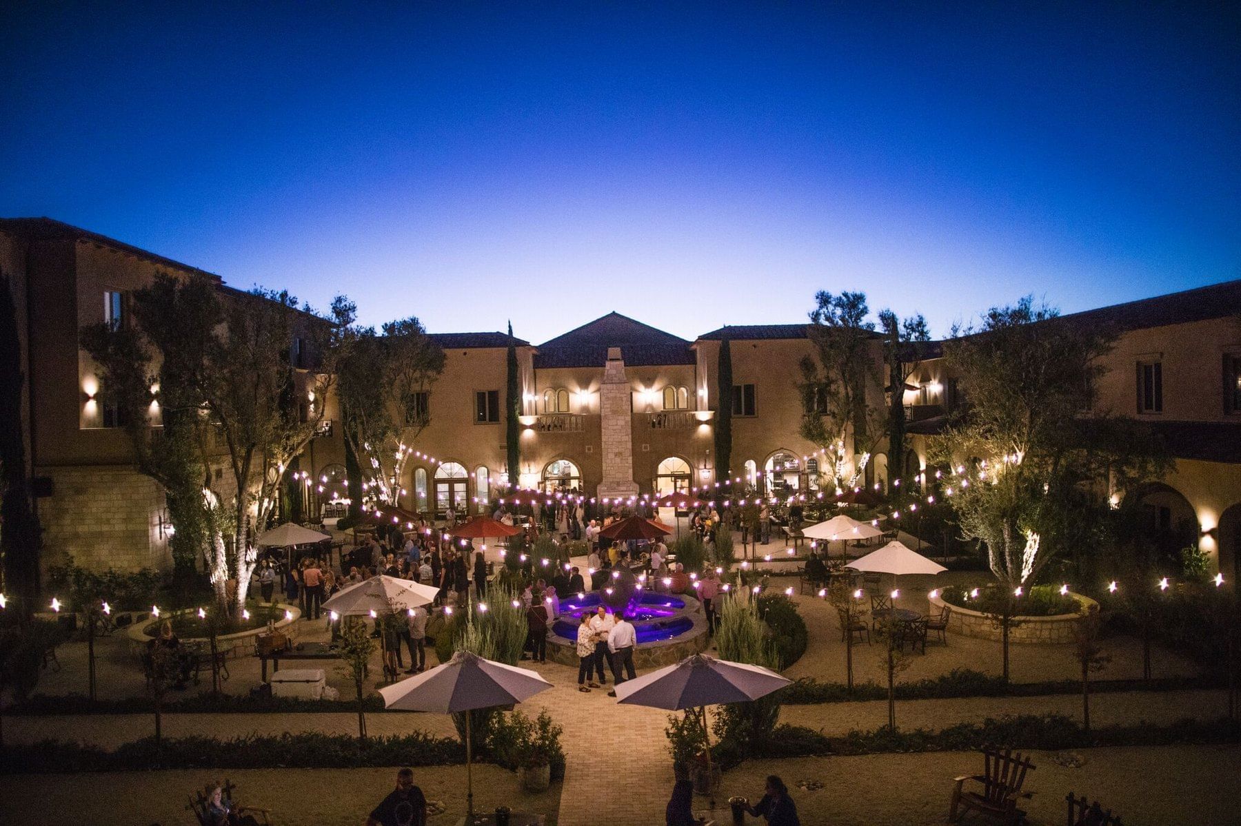 Allegretto's courtyard is lit up at dusk 
