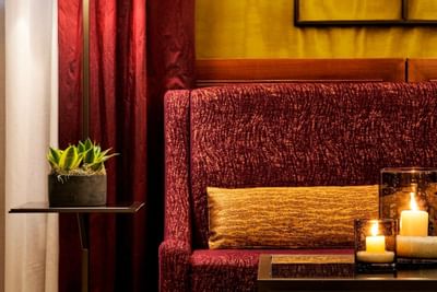 Comfy sofa & lit candles in a livingroom at Hotel Bisanzio