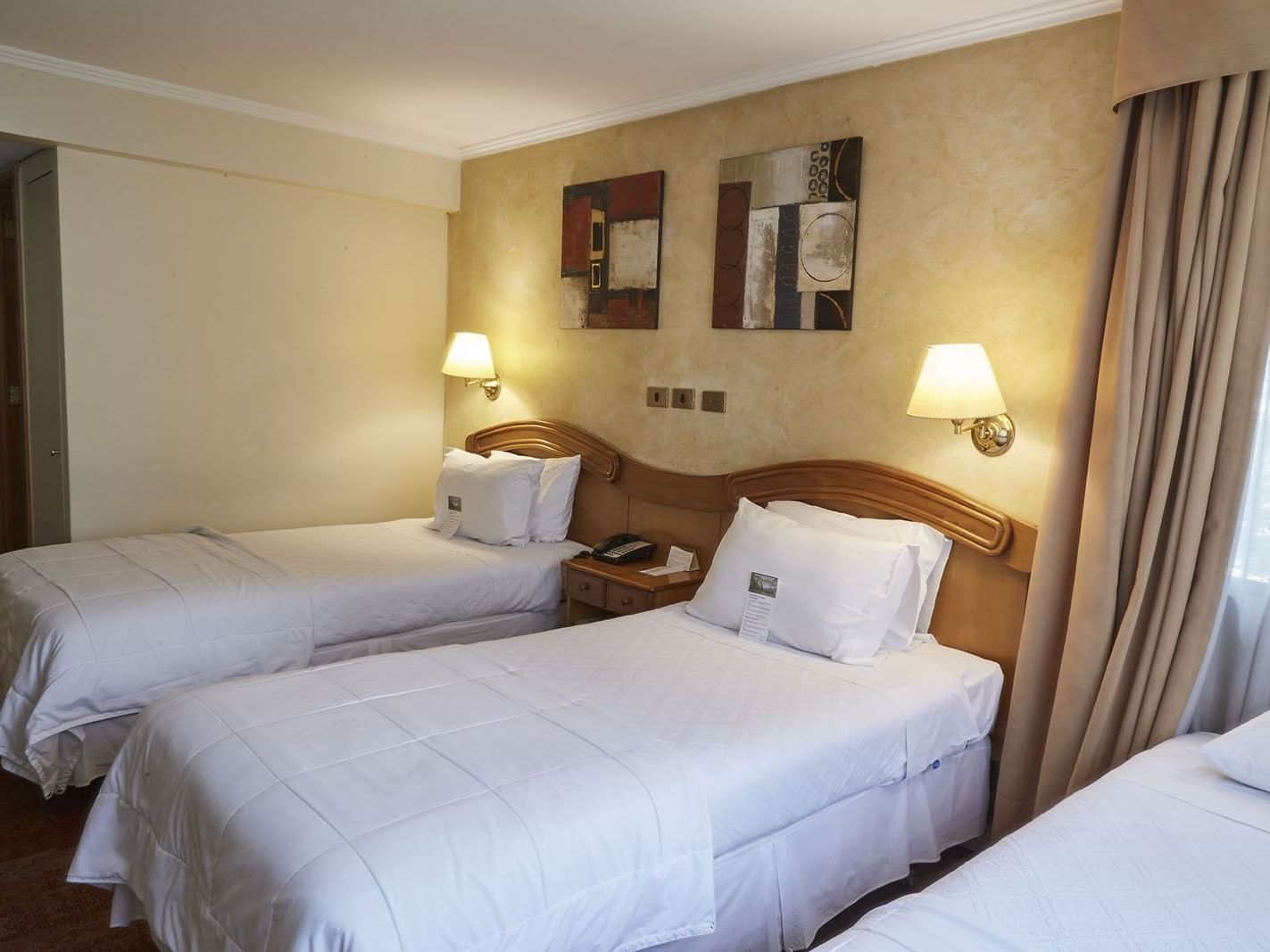 Beds in Standard Triple Room at Hotel Torremayor Lyon