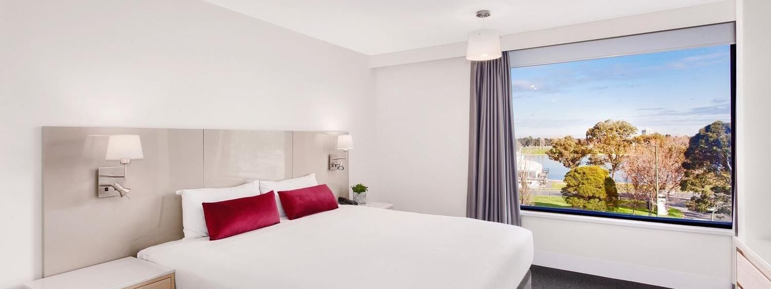King bed by side desk in Mercure Superior One-Bedroom Lakeview Suite at Pullman Albert Park