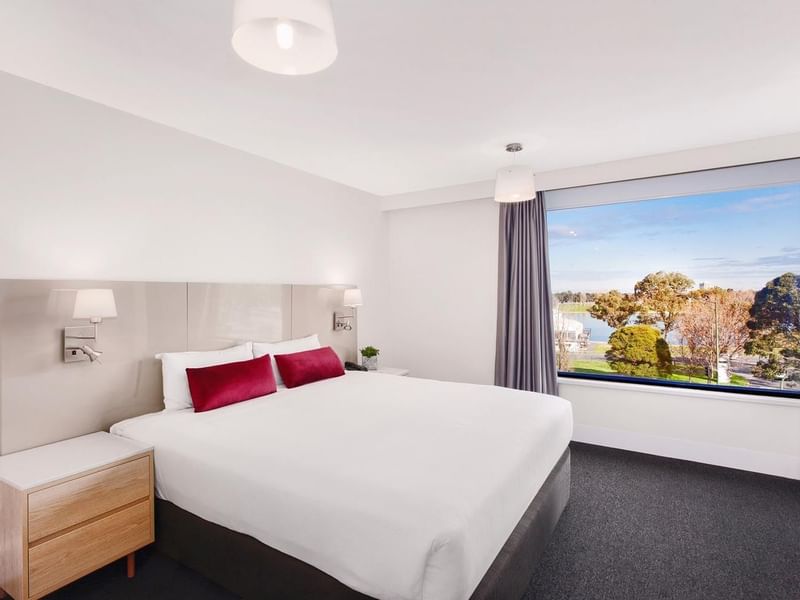 King bed by side desk in Mercure Superior One-Bedroom Lakeview Suite at Pullman Albert Park