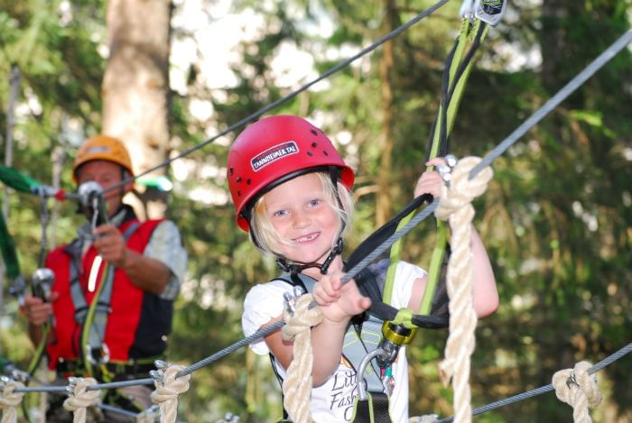 Portrait of a kid at Climbing Forest Tannheim near Liebes Rot