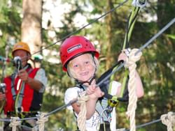 Close-up of a girl zip lining near Liebes Rot Flueh