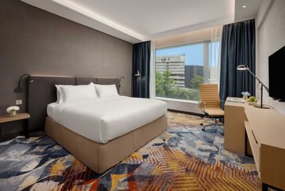 Superior Room with a cozy bed and carpeted floor at Park Hotel Hong Kong