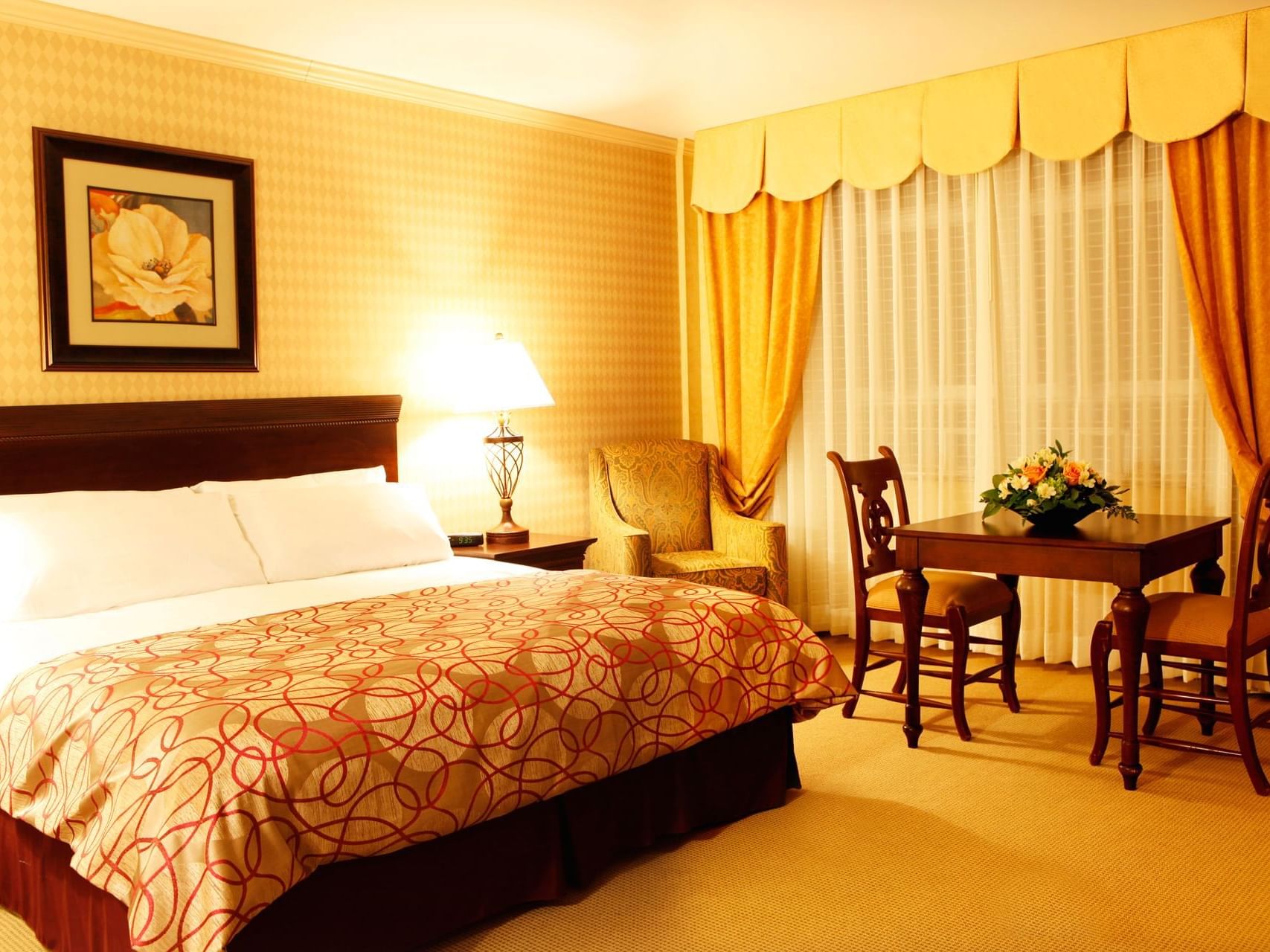 Bed & furniture in Executive Room at Honor’s Haven