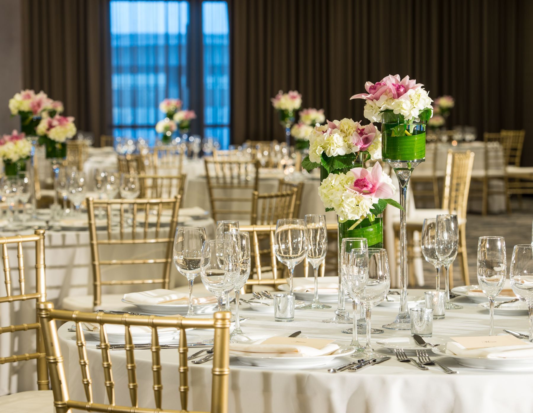 Banquet rounds set with floral centerpieces