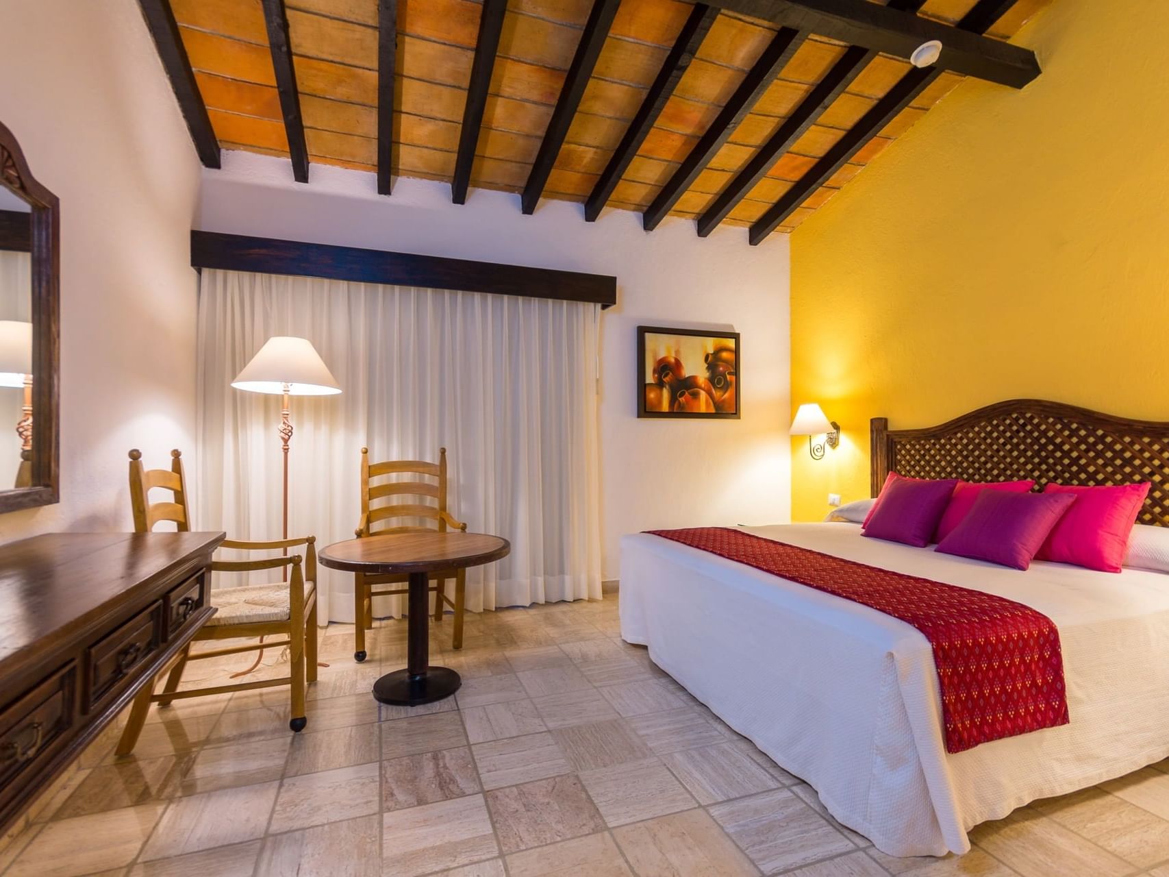 a bed and table in a hotel room