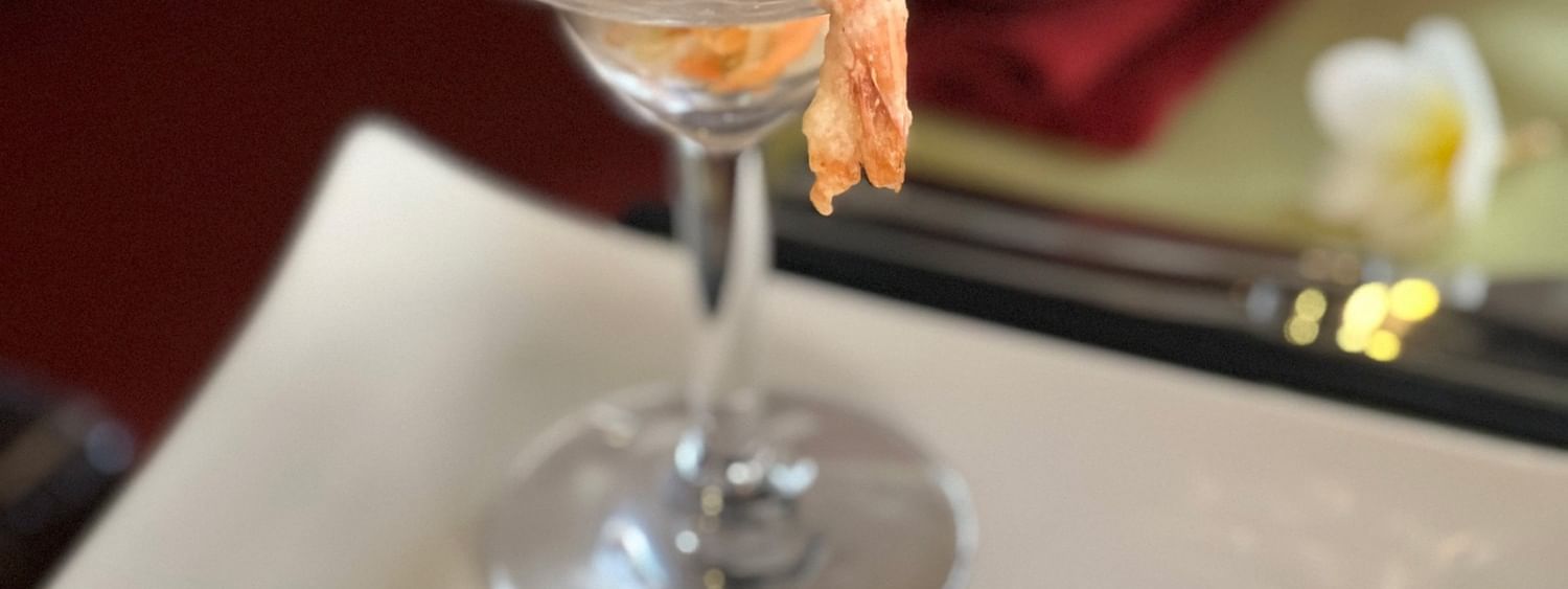 Shrimp dish with lettuce in martini glass on plate at Wild Ginger Restaurant & Bar in Efate at Warwick Le Lagon Vanuatu