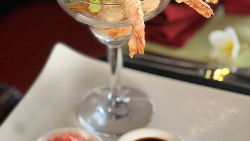 Shrimp dish with lettuce in martini glass on plate at Wild Ginger Restaurant & Bar in Efate at Warwick Le Lagon Vanuatu.