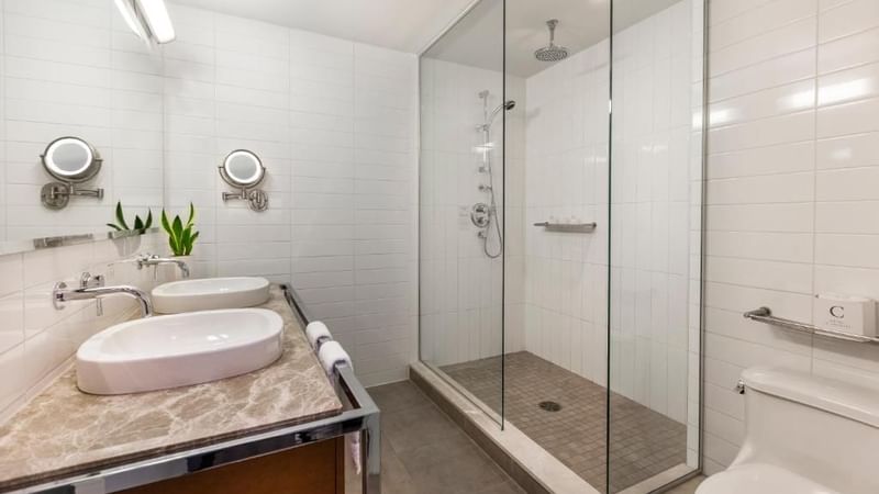 Bathroom with shower and sink in Junior balcony suite at Warwick Le Crystal