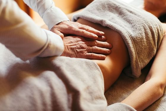 Close-up of a lady receiving a body treatment at Liebes Rot