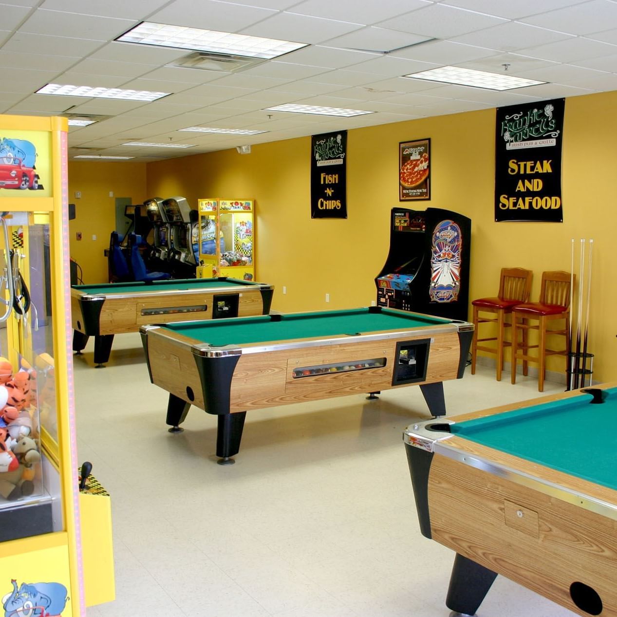 Game room with pool table and arcade games at Lake Buena Vista Resort Village & Spa