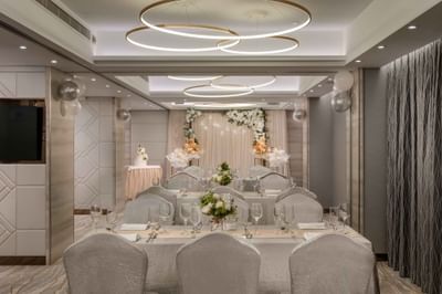 Wedding ceremony arranged with flowers & tables indoors at Park Hotel Hong Kong