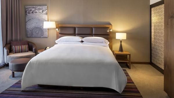 Interior of Deluxe Room 1 King bedroom at FA Hotels & Resorts