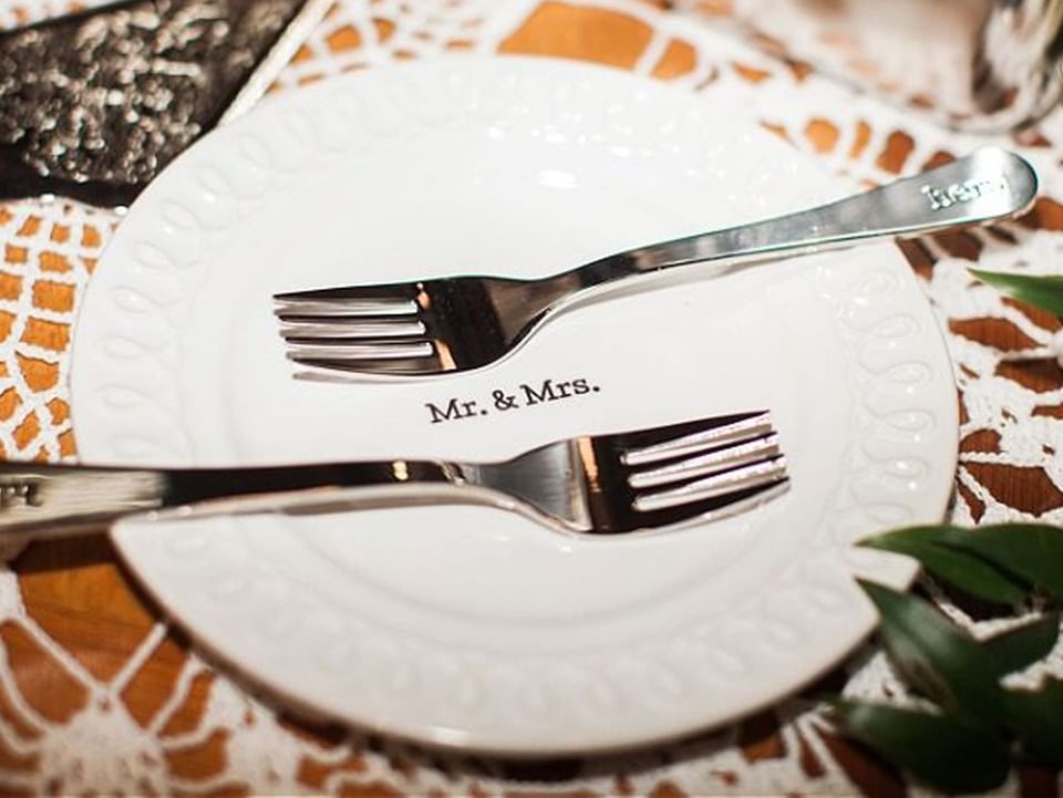 Close-up of a plate with Mr. & Mrs. initials in Inn at the Crossroads