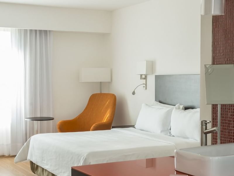 Closeup on bed & sofa in Accessible Room at Fiesta Inn