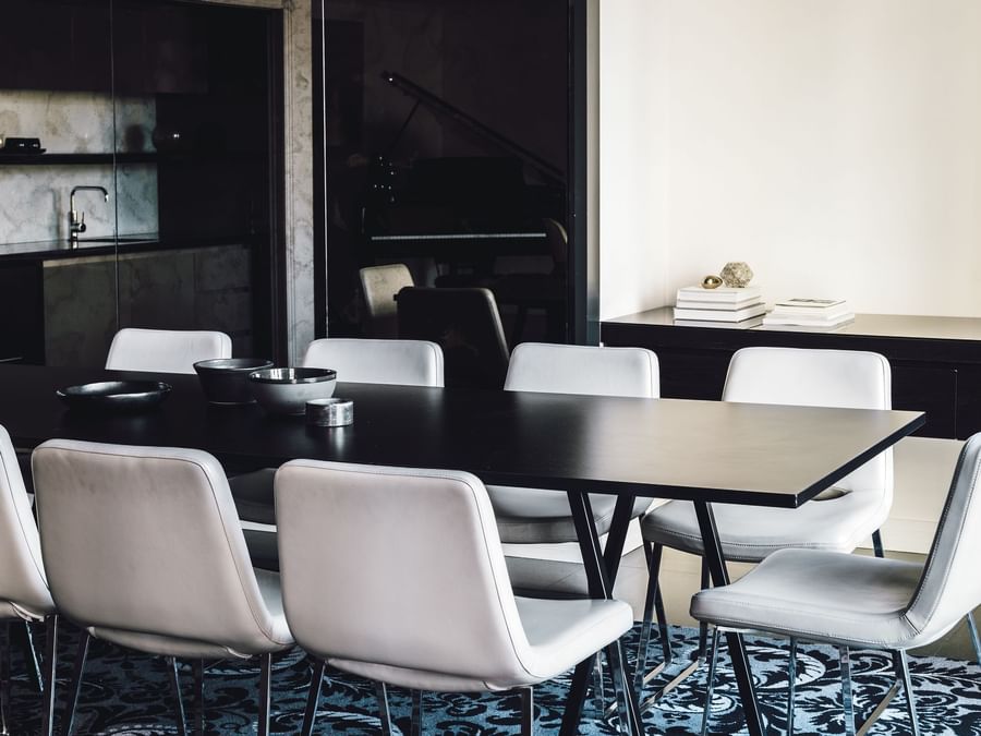 Dining table & kitchen in Gold Penthouse at Como Melbourne