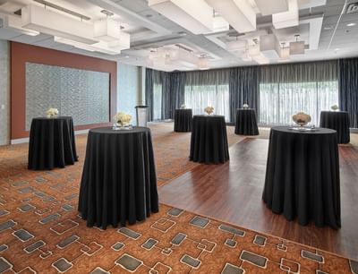 Round cocktail table setup in an Amber ballroom at Matrix Hotel