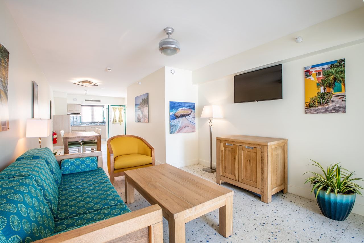 Living room with wooden furniture & decor in Penthouse at Amsterdam Manor Beach Resort