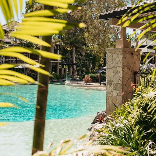 Outdoor pool area at Pullman Palm Cove Sea Temple Resort & Spa