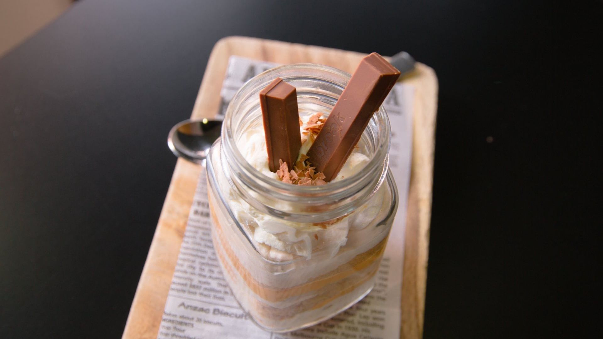 Dessert in a glass jar with cream, chocolate, and two Kit Kat bars, served at Ibis Adelaide